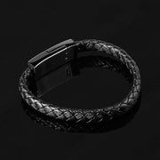 Black braided leather bracelet on a black background